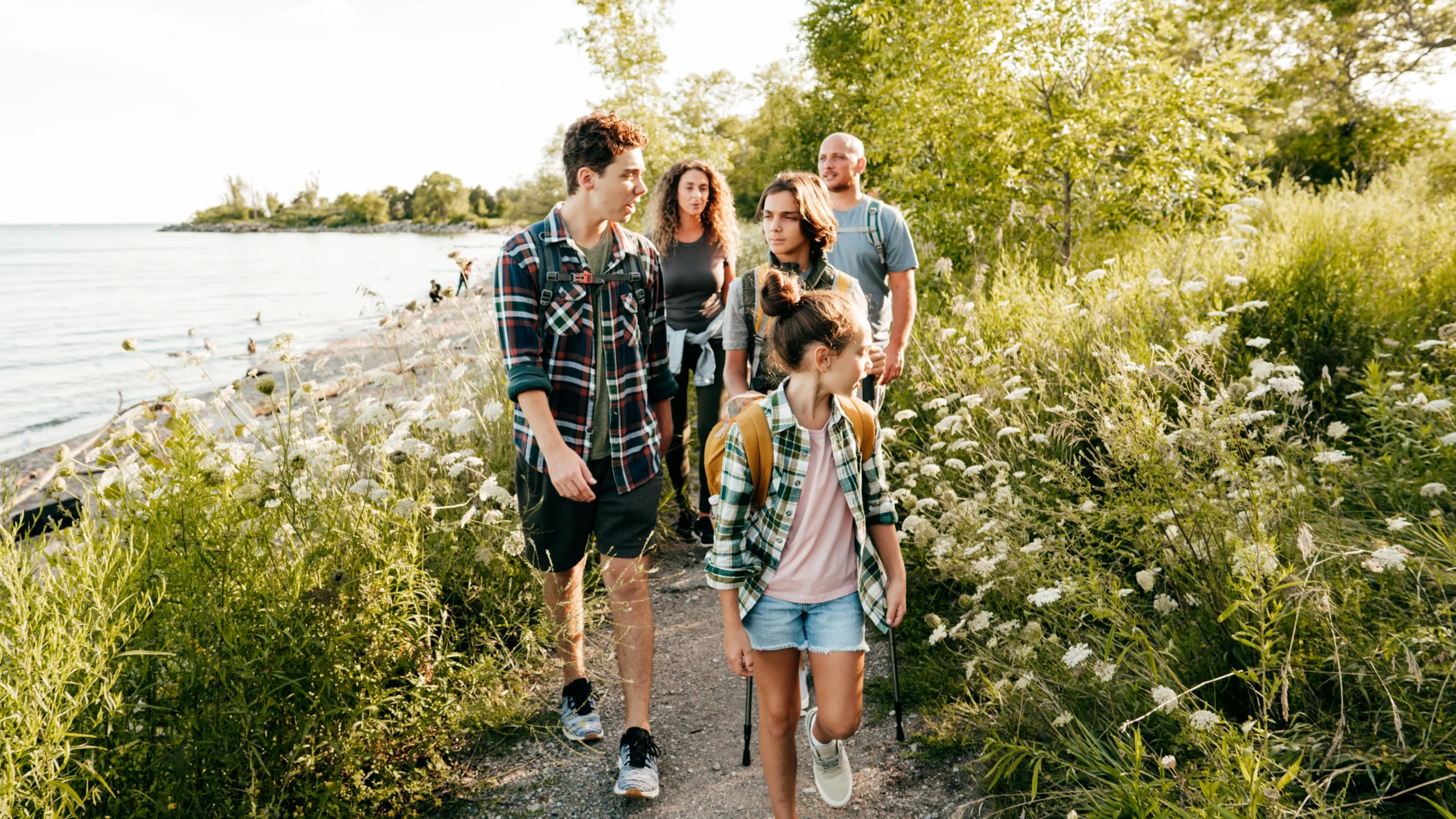 Family-walking-next-lake