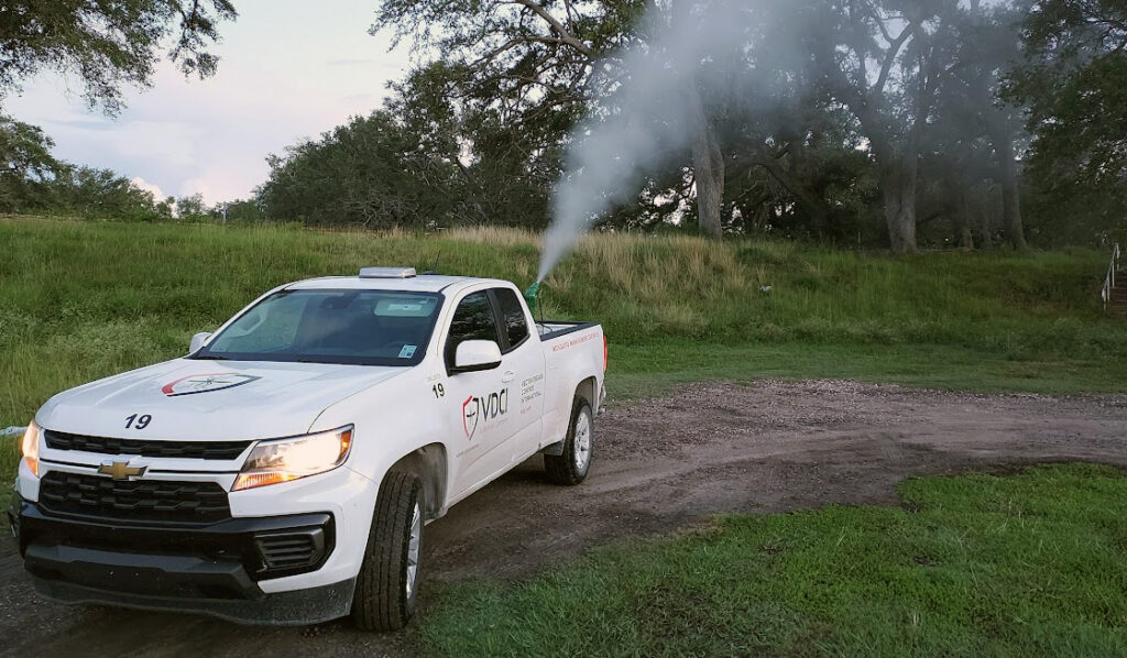truck spraying mosquito adulticide