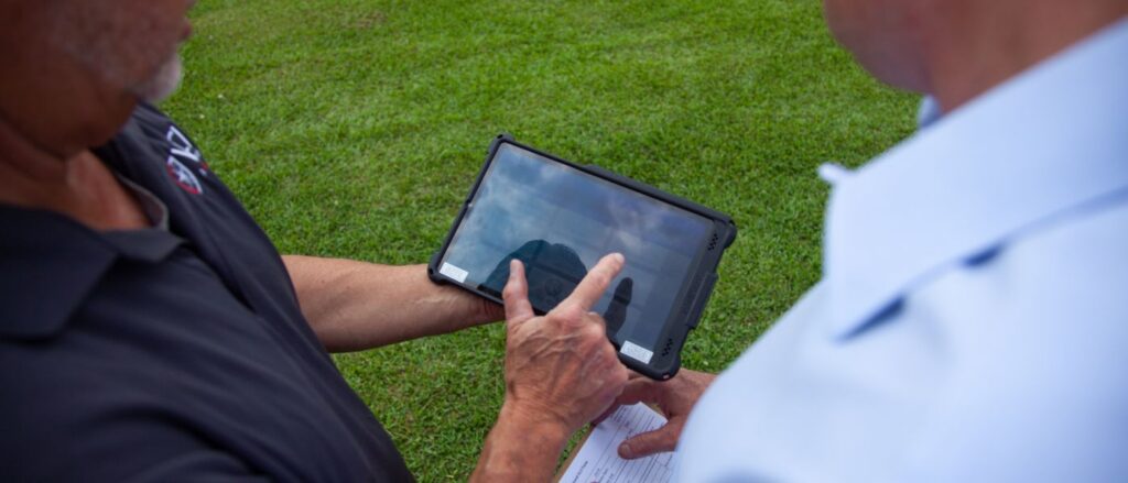mosquito expert reviewing surveillance data on tablet