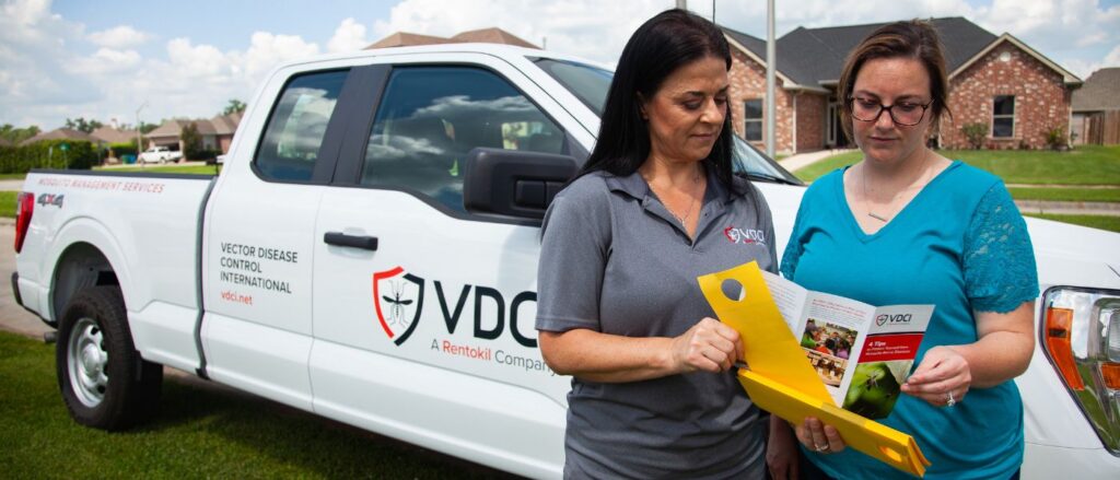 vdci mosquito expert speaking with customer about mosquito control