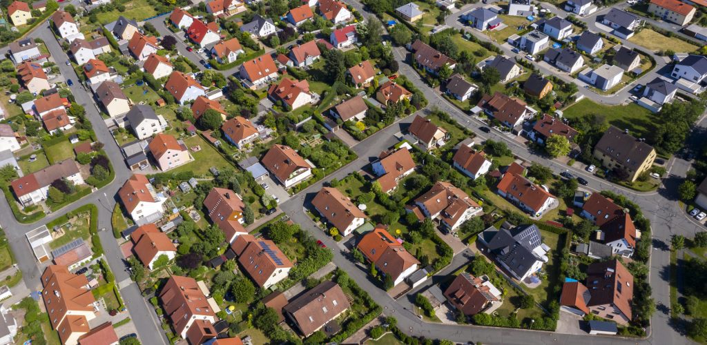 Aerial view above suburb houses houses-in-neighborhood
